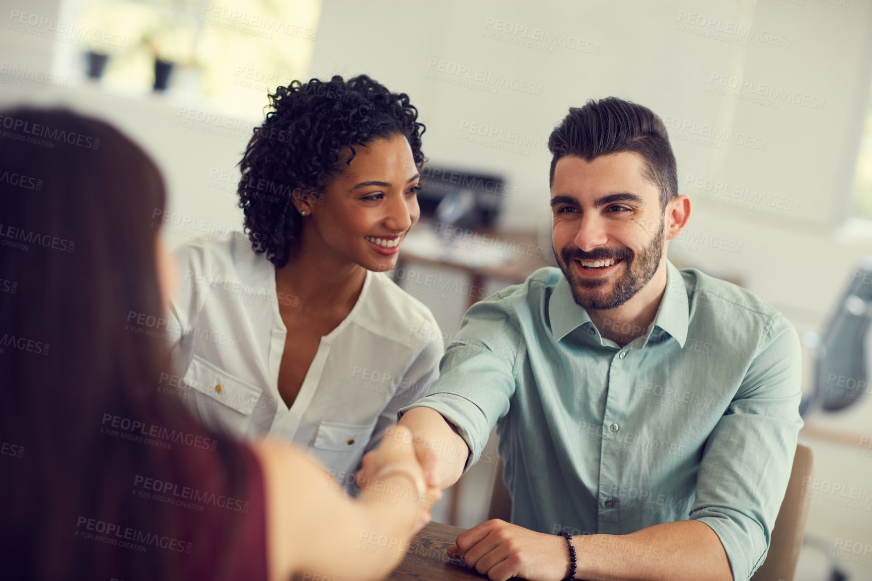 Buy stock photo Cropped shot of an unrecognizable female therapist meeting a couple for a counselling session