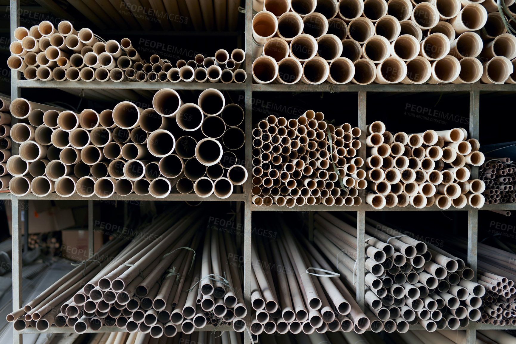 Buy stock photo Pipes, warehouse and shelves with plumbing material in workshop, factory and production for manufacturing. Construction, storage and materials for industrial process, building and water resources