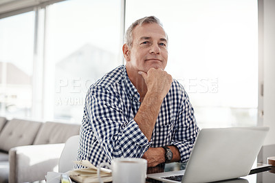 Buy stock photo Portrait of a mature man working on a laptop at home