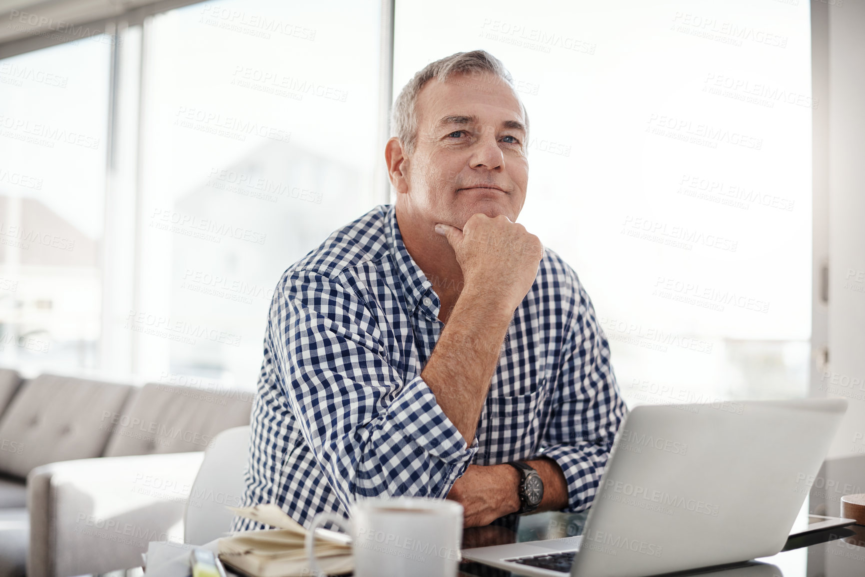 Buy stock photo Portrait of a mature man working on a laptop at home