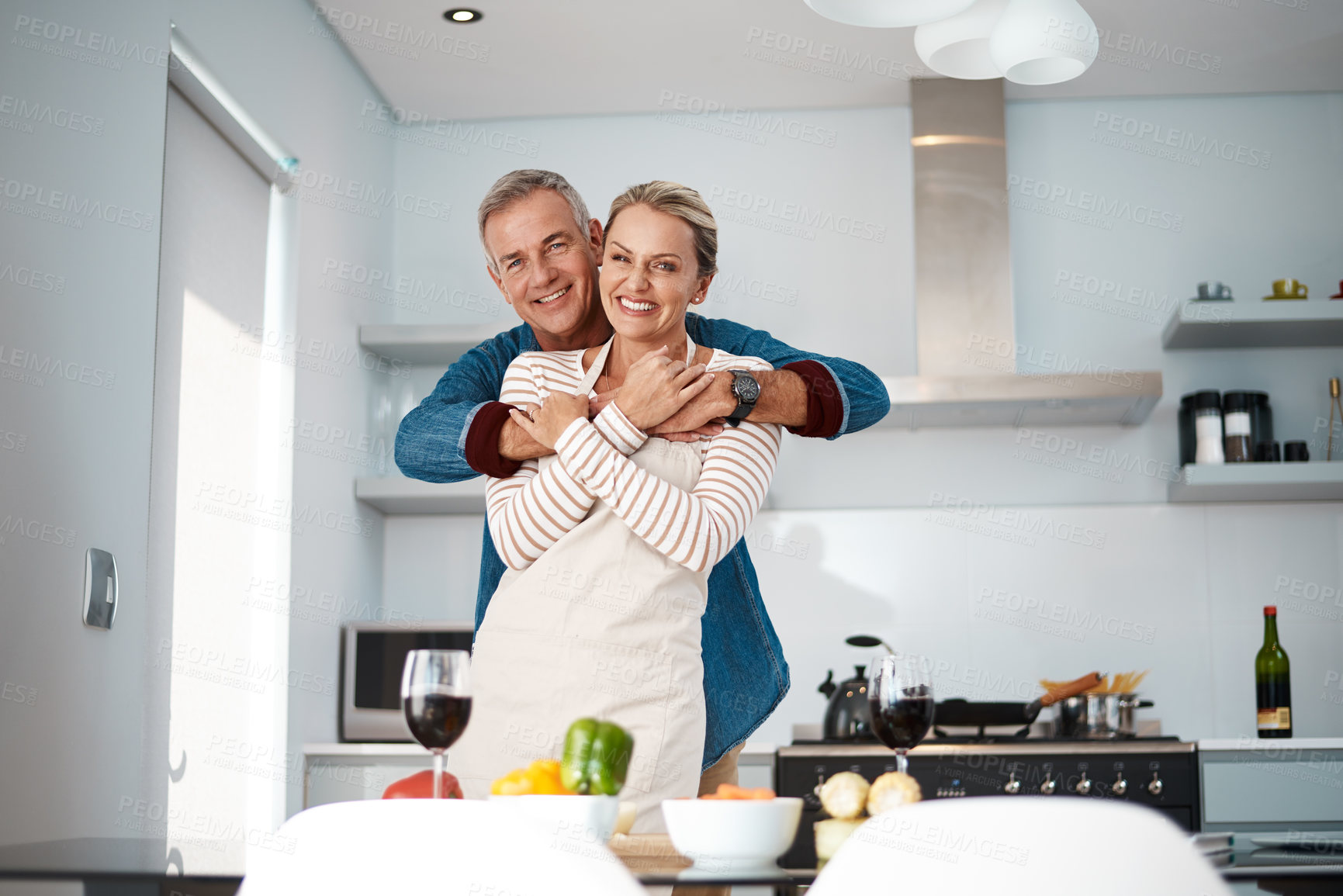 Buy stock photo Cropped shot of a loving couple in the kitchen