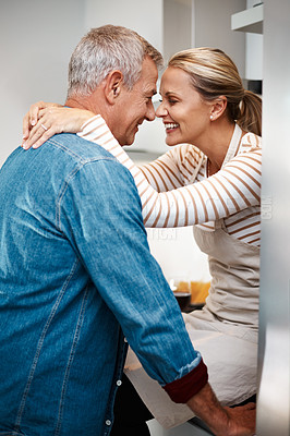 Buy stock photo Cropped shot of a loving couple in the kitchen