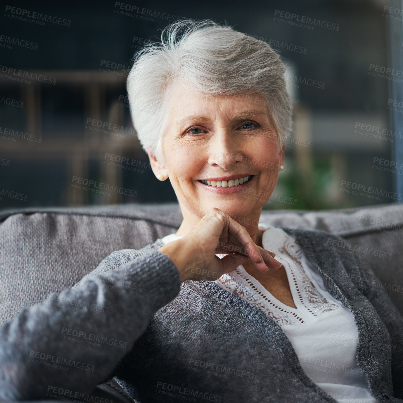 Buy stock photo Portrait of a senior woman relaxing on the sofa at home