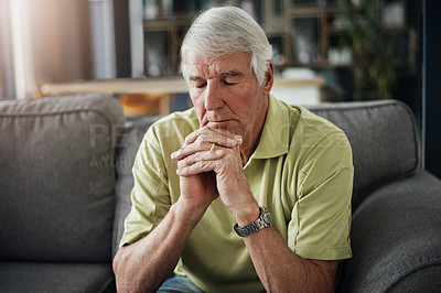 Buy stock photo Shot of a senior man suffering from stress at home