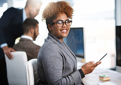 Buy stock photo Cropped portrait of an attractive young businesswoman working at her desk in a modern office