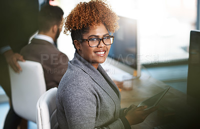 Buy stock photo High angle portrait of an attractive young businesswoman working at her desk in a modern office
