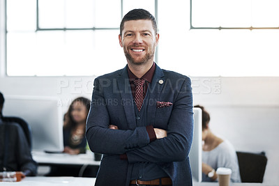 Buy stock photo Portrait of a confident mature businessman working in a modern office