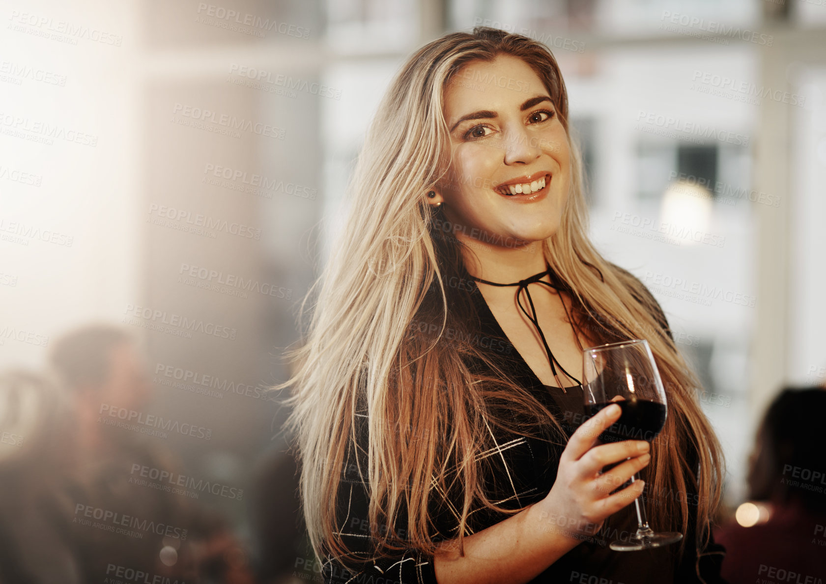 Buy stock photo Portrait of a beautiful young woman enjoying herself at a get together