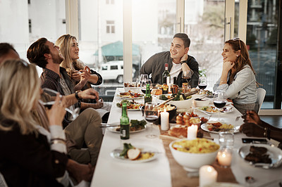 Buy stock photo Shot of friends getting together for a dinner party