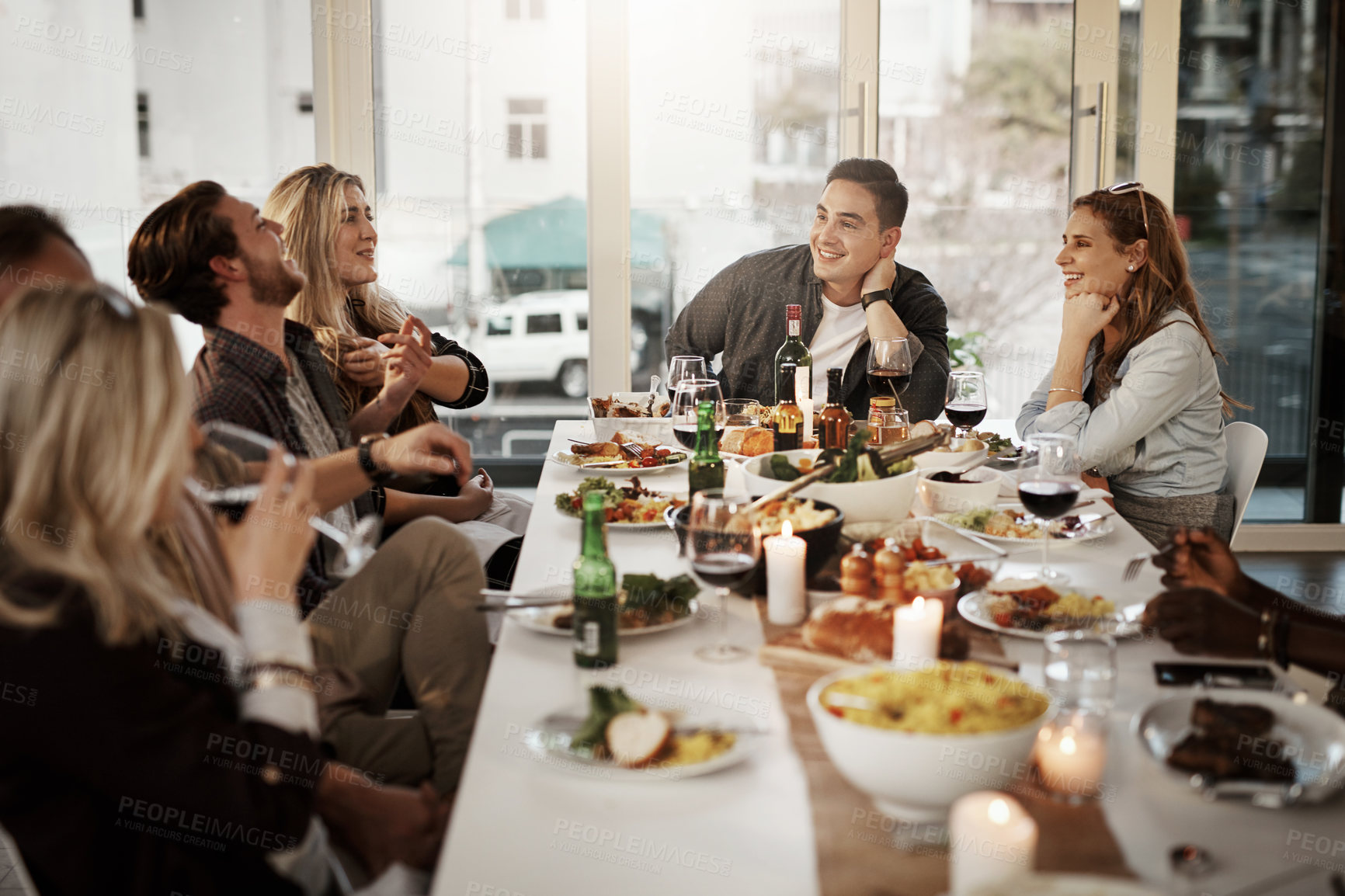 Buy stock photo Shot of friends getting together for a dinner party