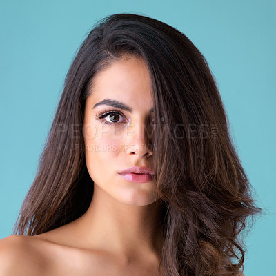 Buy stock photo Hair care, beauty and portrait of woman in studio for cosmetics, keratin treatment or natural glow on blue background. Salon, aesthetic and model with hairstyle for confident, satisfaction or shampoo