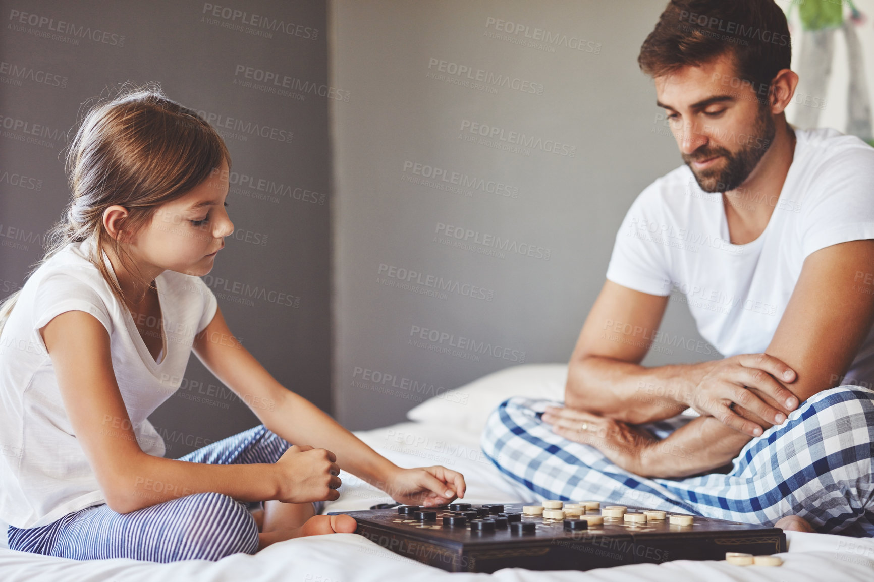 Buy stock photo Play, child and father with checkers in home for teaching, playing and learning for childhood development. Bedroom, dad and daughter with board game for competition, problem solving and bonding