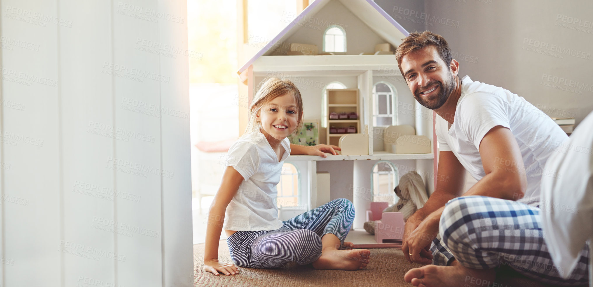Buy stock photo Shot of a father spending quality time with his little daughter at home
