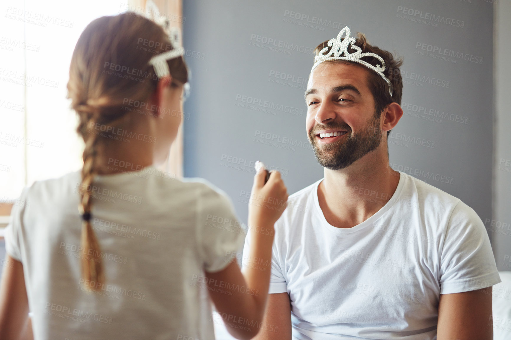 Buy stock photo Cropped shot of a little girl putting makeup on her father