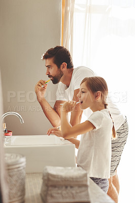 Buy stock photo Brushing teeth, dad and young child in a bathroom at home in morning with dental cleaning. Oral hygiene, kids and father together in a house with bonding and parent love for children with toothbrush