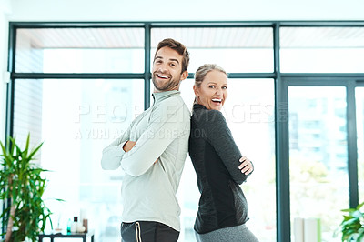 Buy stock photo Cropped shot of two people standing together in a fitness center