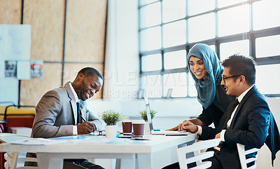 Buy stock photo Shot of a group of confident young businesspeople having a meeting together in the office at work during the day