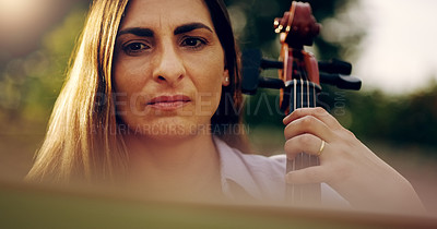 Buy stock photo Cropped shot of a beautiful woman playing a cello in the backyard