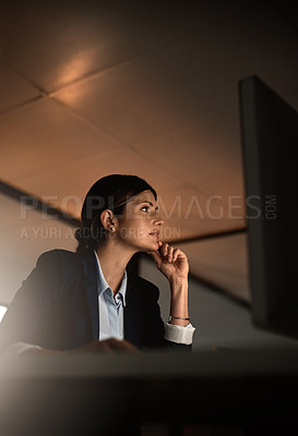 Buy stock photo Thinking, concentration and woman in office at night reading email, proposal or online report at start up agency. Corporate overtime, challenge and focus, businesswoman at desk working late on ideas.