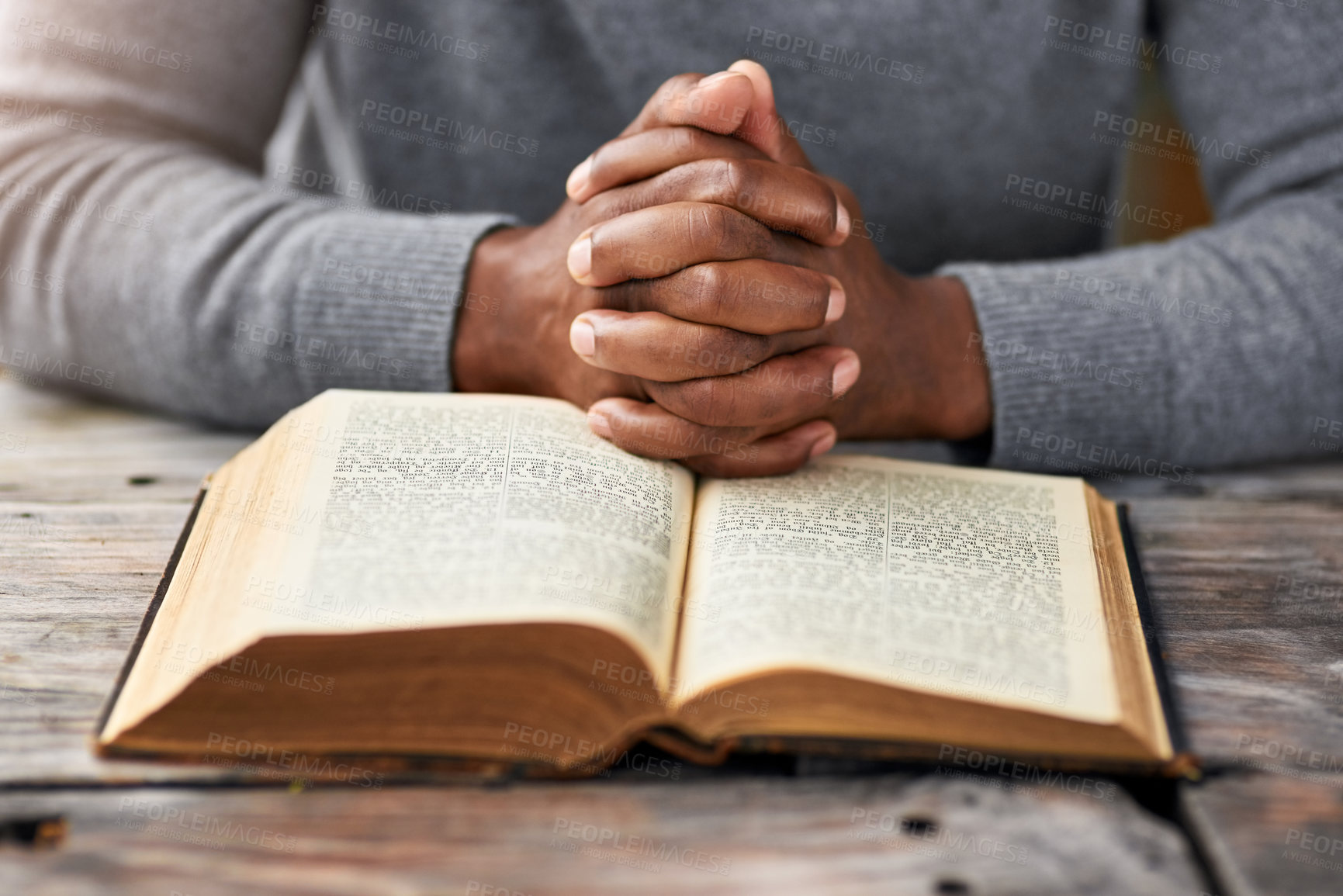 Buy stock photo Closeup, hands and Christian person reading book in spiritual religion for peace, guidance and learning. Bible, education or worship with praise, scripture and gratitude with prayer, faith and gospel