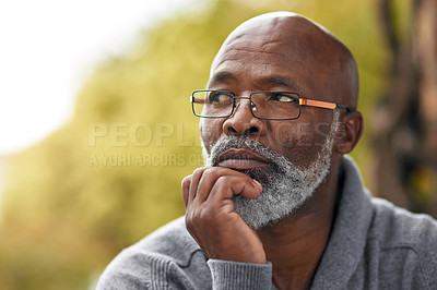 Buy stock photo Senior man, face and thinking outdoor in nature to remember memory, idea or vision. Headshot of an elderly African male person think or planning future, life insurance or retirement at a park