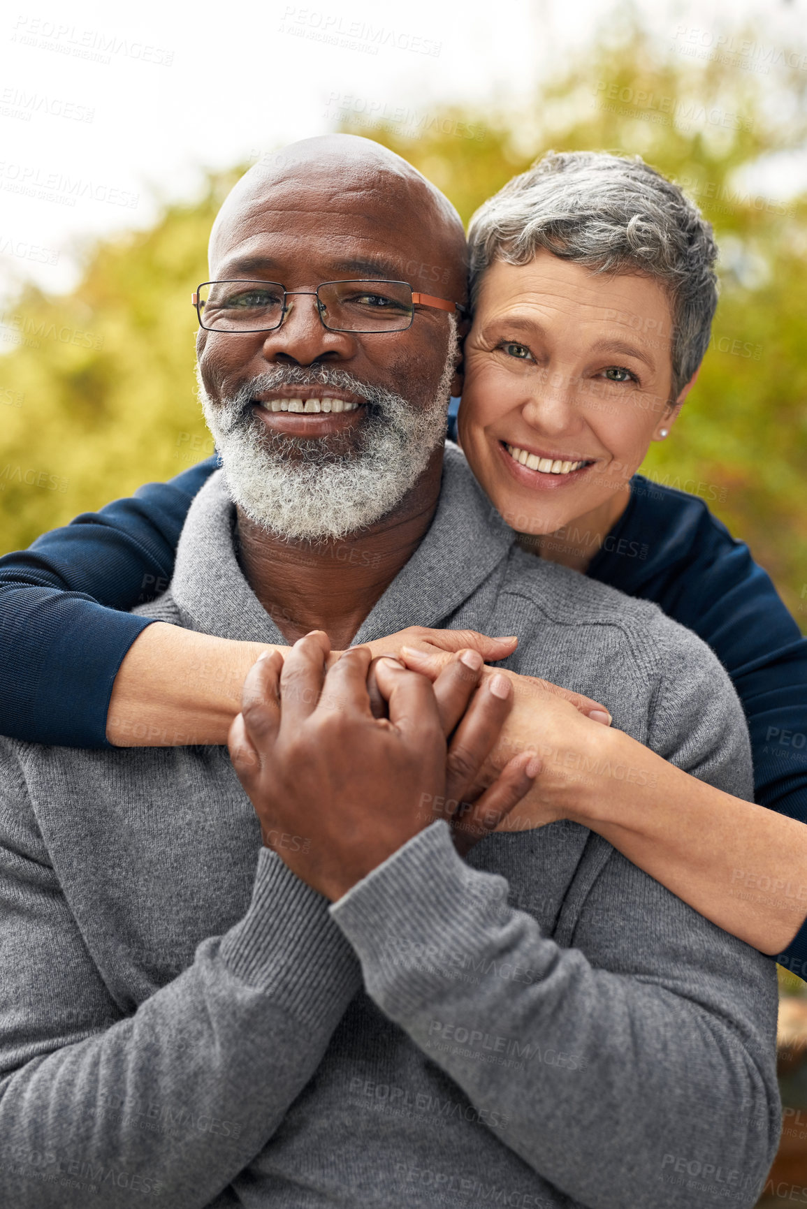 Buy stock photo Portrait, park or senior couple with hug, interracial or romantic with bonding, marriage or relationship. Face, mature black man or elderly woman embrace, retirement or partners with romance or love