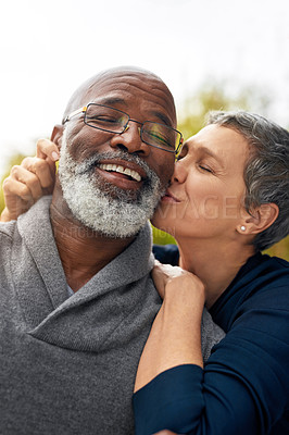 Buy stock photo Cropped shot of an affectionate senior couple enjoying some quality time in the park