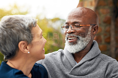 Buy stock photo Cropped shot of an affectionate senior couple enjoying some quality time in the park
