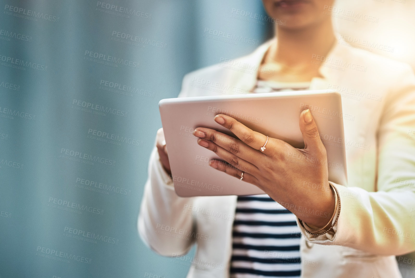 Buy stock photo Closeup shot of an unrecognizable businesswoman using a digital tablet in the city