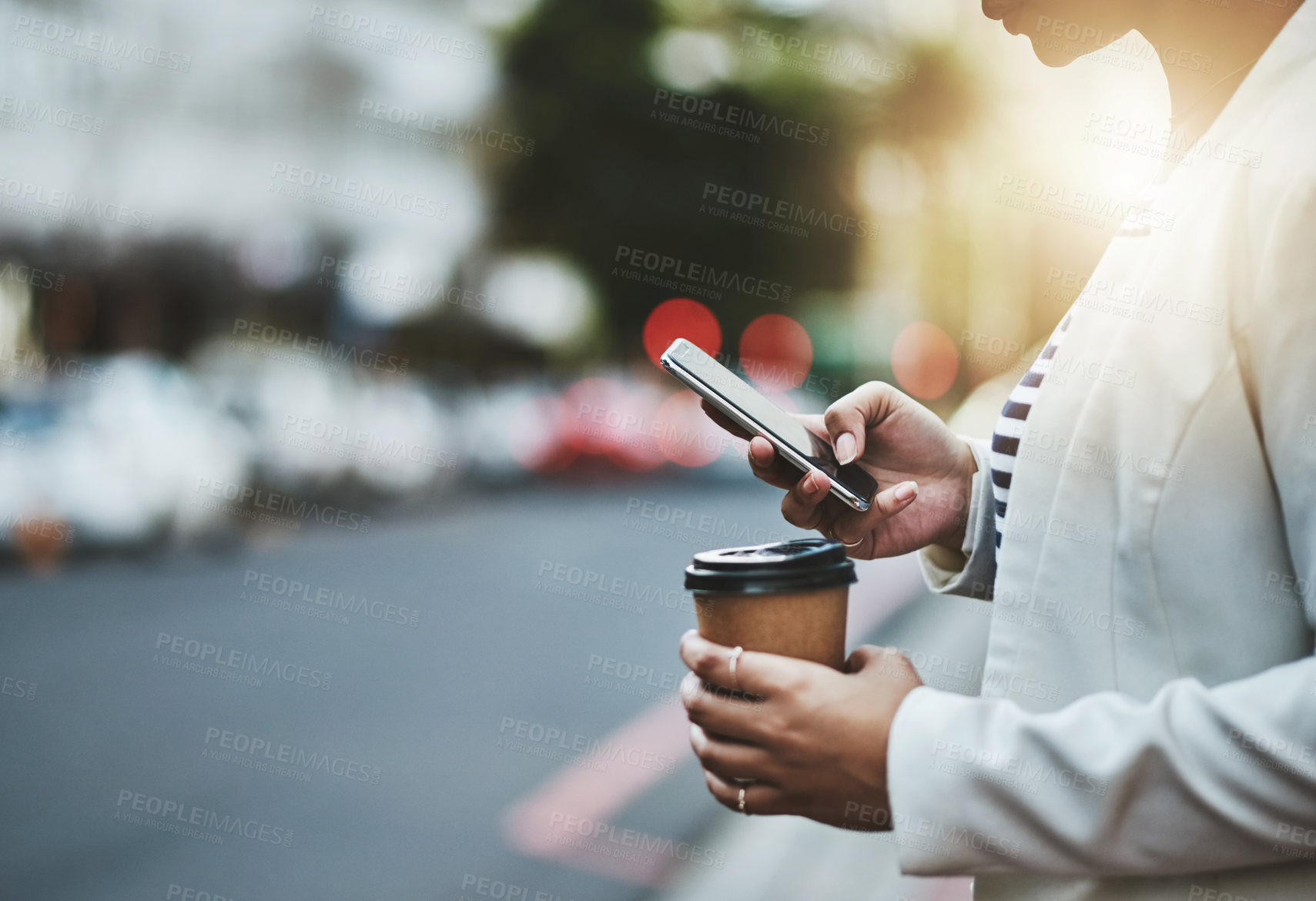 Buy stock photo Closeup shot of an unrecognizable businesswoman using a cellphone in the city