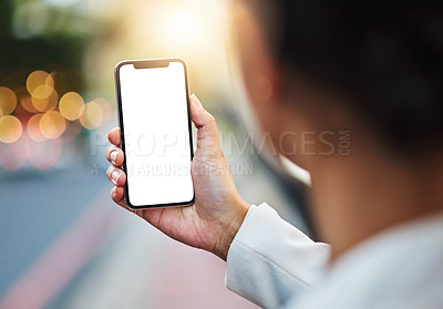 Buy stock photo Closeup shot of an unrecognizable businesswoman using a cellphone with a blank screen in the city