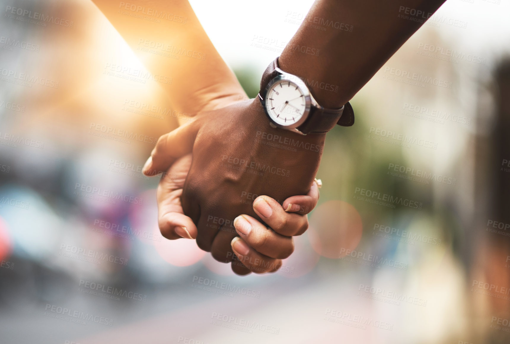 Buy stock photo Cropped shot of an affectionate couple holding hands outdoors