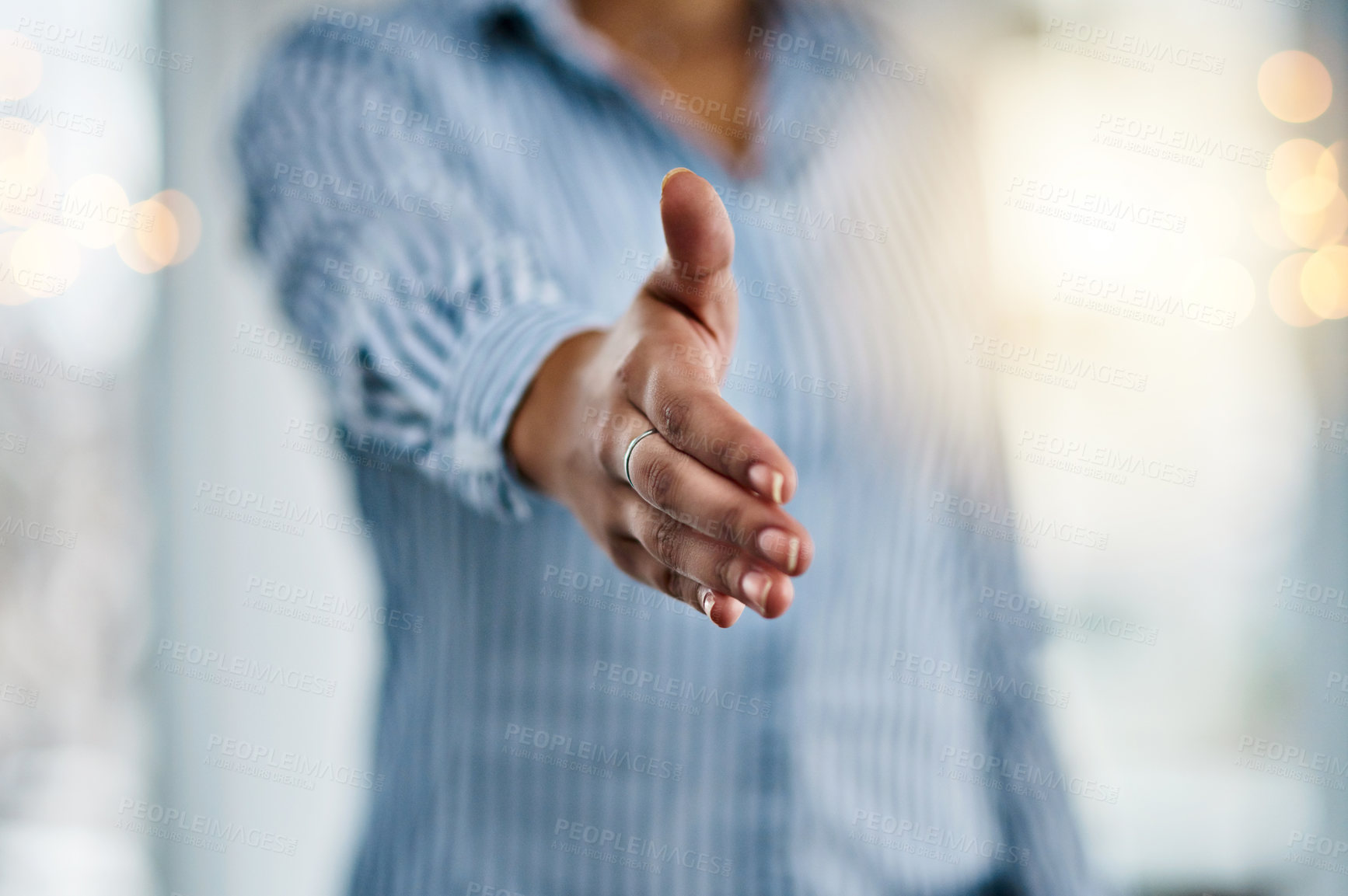 Buy stock photo Closeup shot of an unrecognizable businesswoman extending a handshake in an office