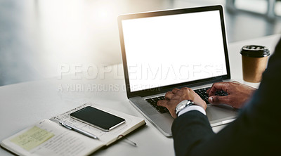 Buy stock photo High angle shot of an unrecognizable young businessman working on his laptop in a modern office