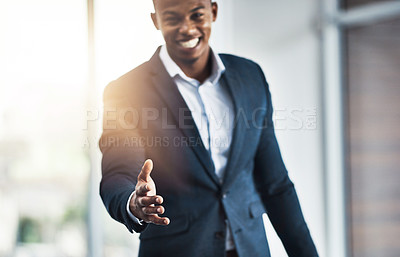 Buy stock photo Cropped portrait of a handsome young businessman offering his hand while standing in his modern office