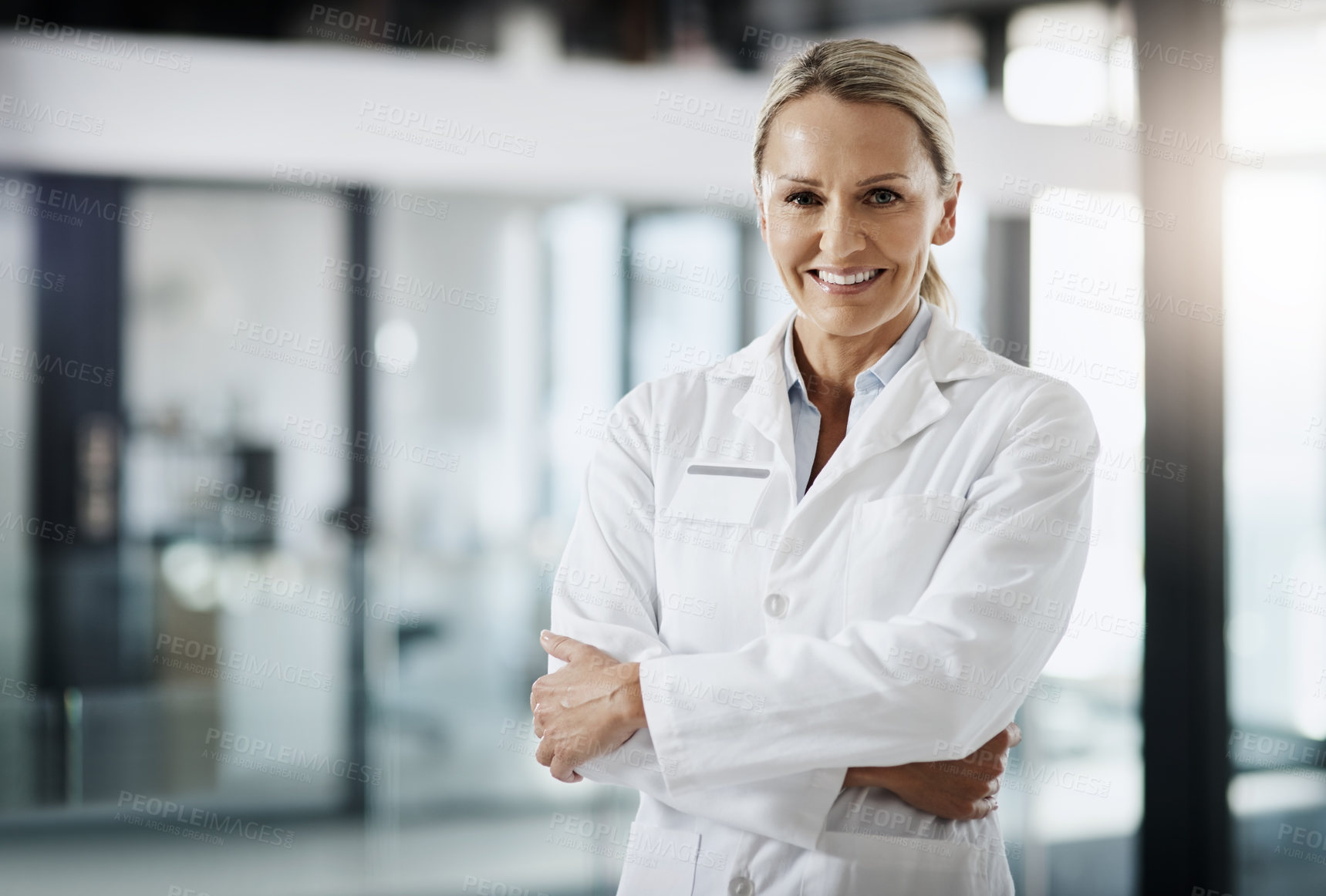 Buy stock photo Cropped portrait of an attractive mature female scientist standing with her arms folded in her lab