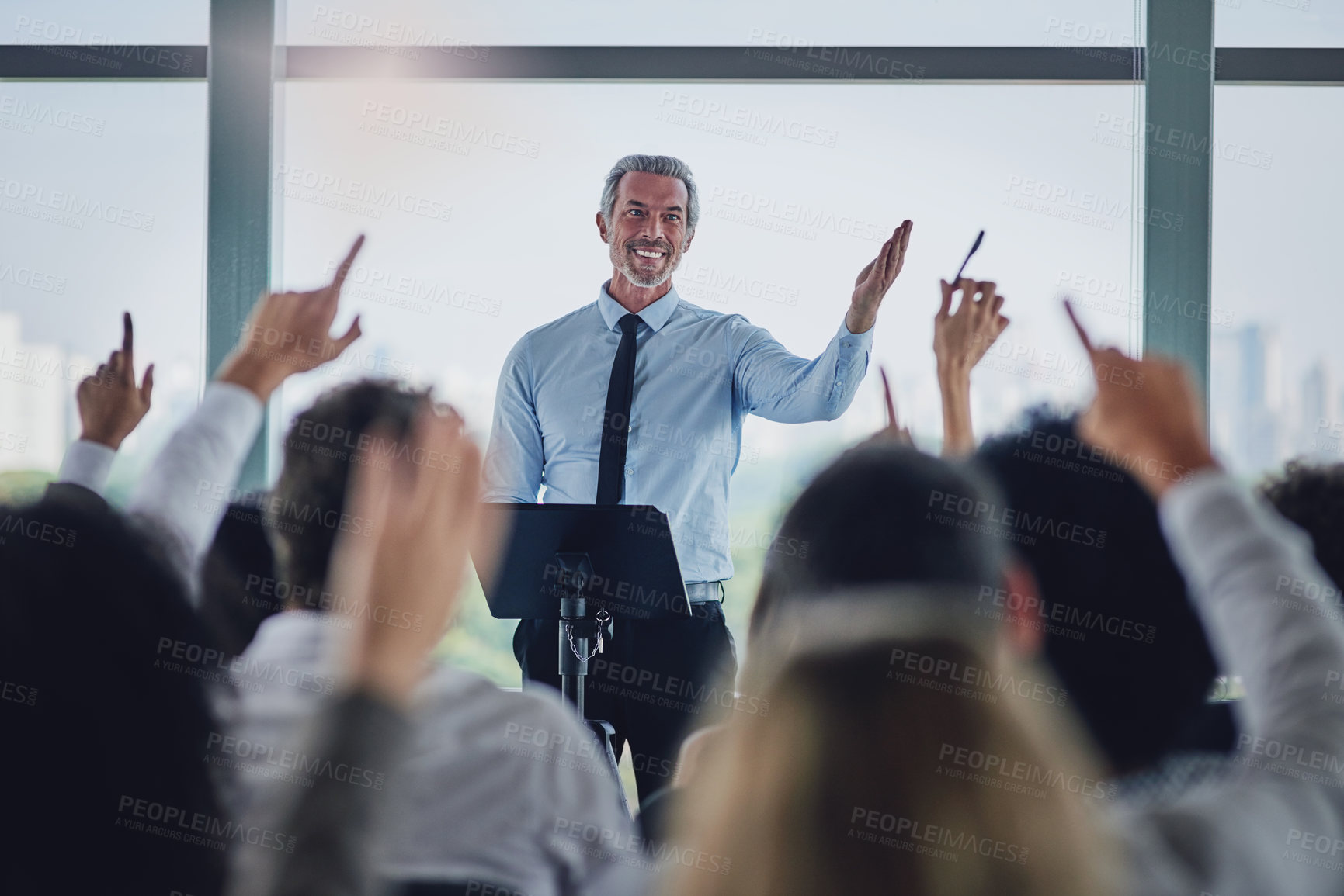 Buy stock photo Man, speaker and people at seminar with questions, company opinion and sharing information in office. Presentation, mature mentor or group in conference room for FAQ, staff training or business vote