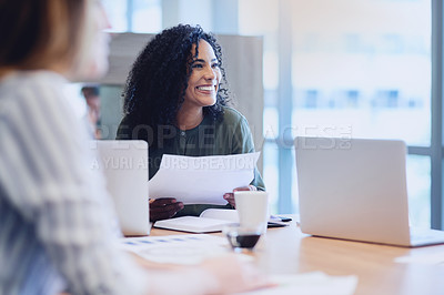 Buy stock photo Cropped shot of an attractive young businesswoman addressing her colleagues during a meeting in the boardroom