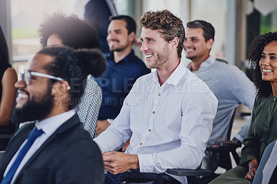 Buy stock photo High angle shot of a group of businesspeople sitting in the conference room during a seminar