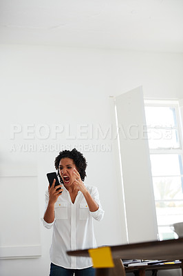 Buy stock photo Cropped shot of a young businesswoman shouting at her cellphone in anger at the office
