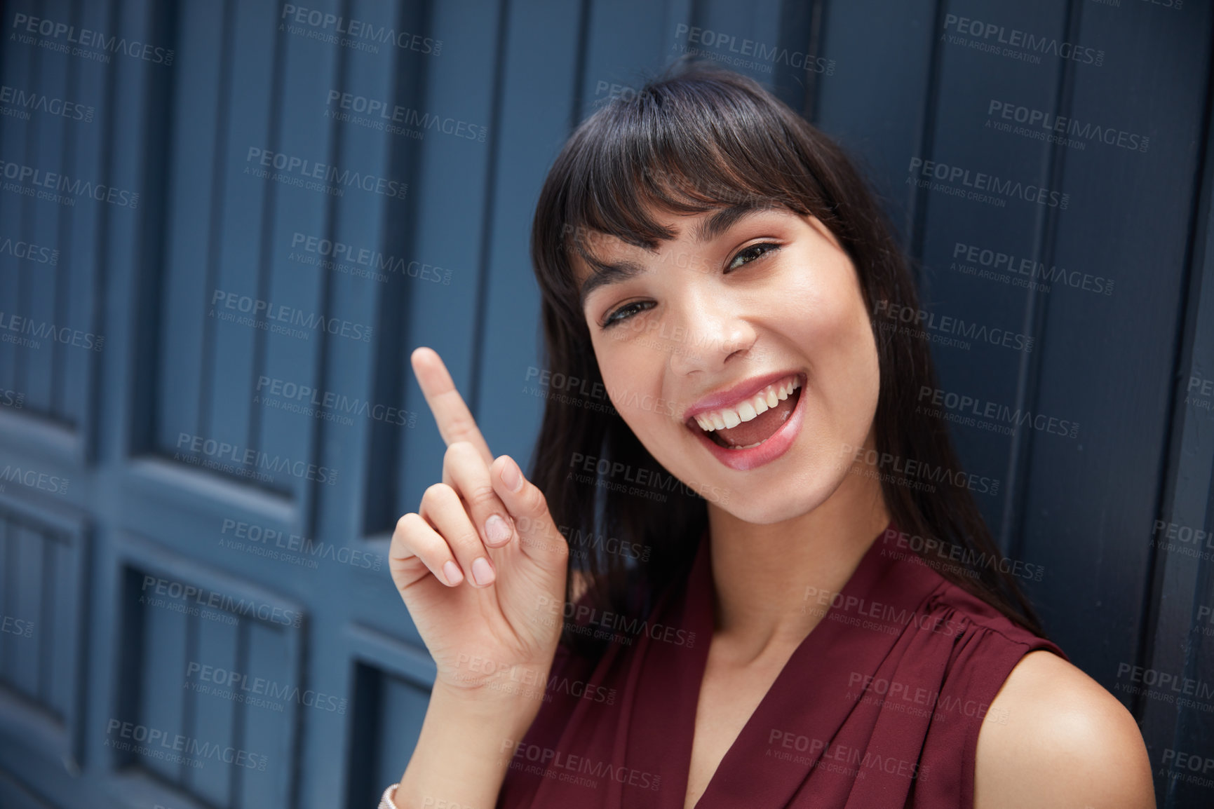 Buy stock photo Cropped shot of a young attractive businesswoman pointing at a empty space in a corridor at the office