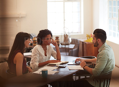 Buy stock photo Cropped shot of young businesspeople having a meeting in the office