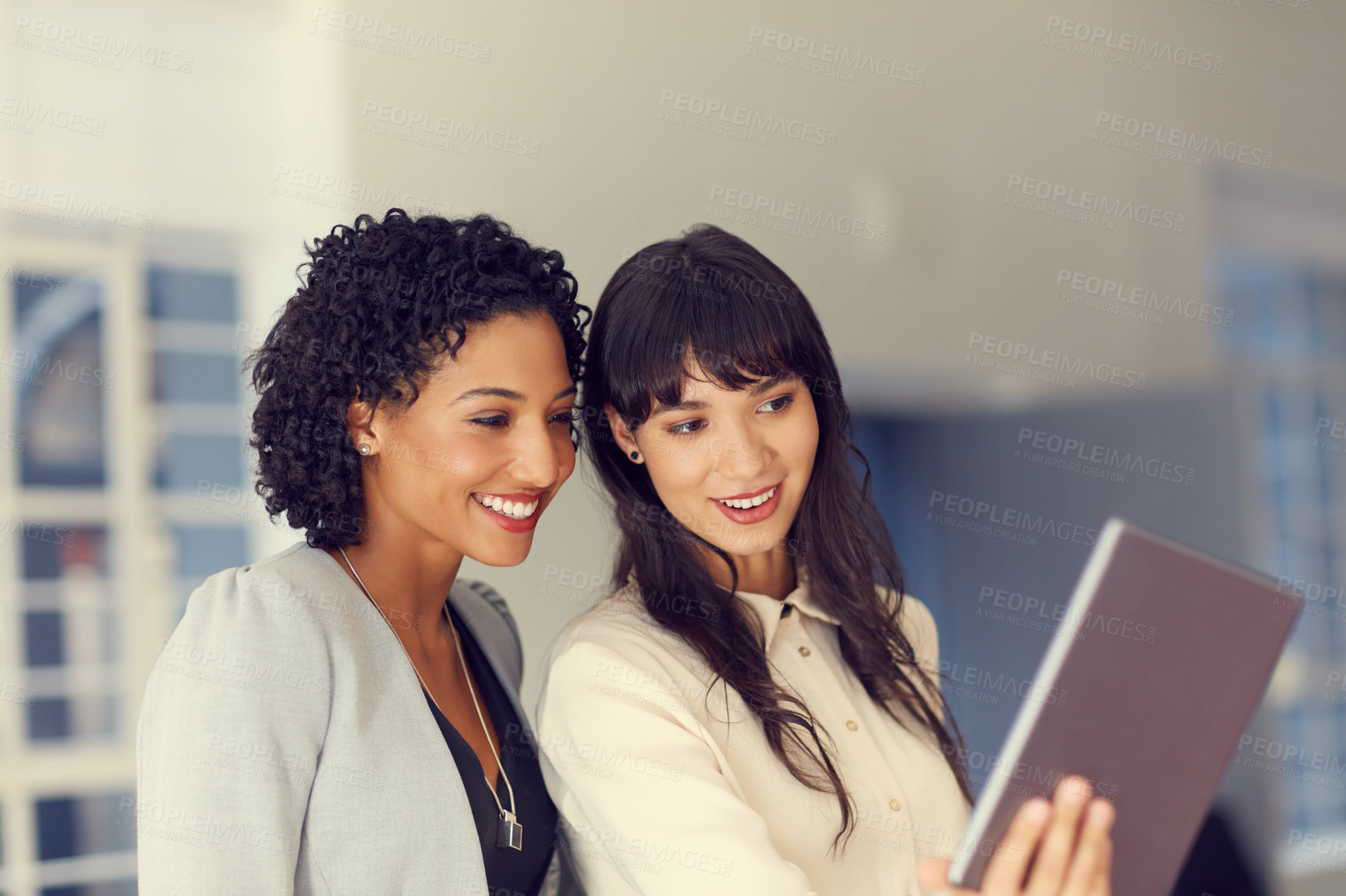Buy stock photo Cropped shot of businesswomen taking a selfie using a tablet in the office