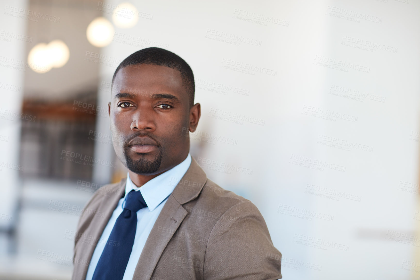 Buy stock photo Portrait of a handsome young businessman in the office