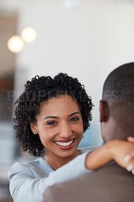 Buy stock photo Cropped shot of a young couple embracing each other in the office