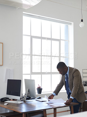 Buy stock photo Cropped shot of a young businessman in the office