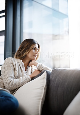 Buy stock photo Shot of a beautiful young woman spending the day at home