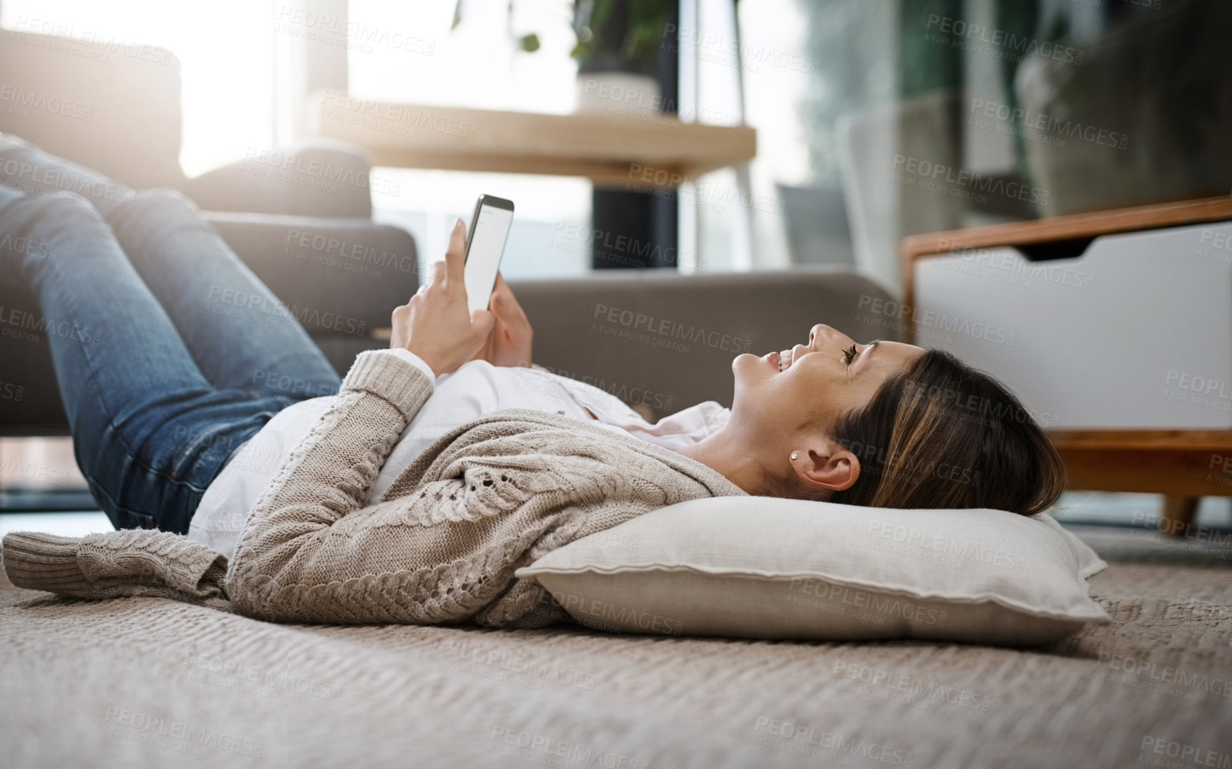 Buy stock photo Woman, cellphone and mockup space in home for relax online shopping, scrolling or digital app. Female person, floor and resting in lounge with smartphone or smile for internet, connection or message