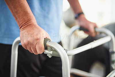 Buy stock photo Closeup shot of a senior man using a walker