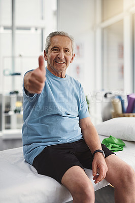 Buy stock photo Shot of a senior man showing thumbs up in a rehabilitation centre